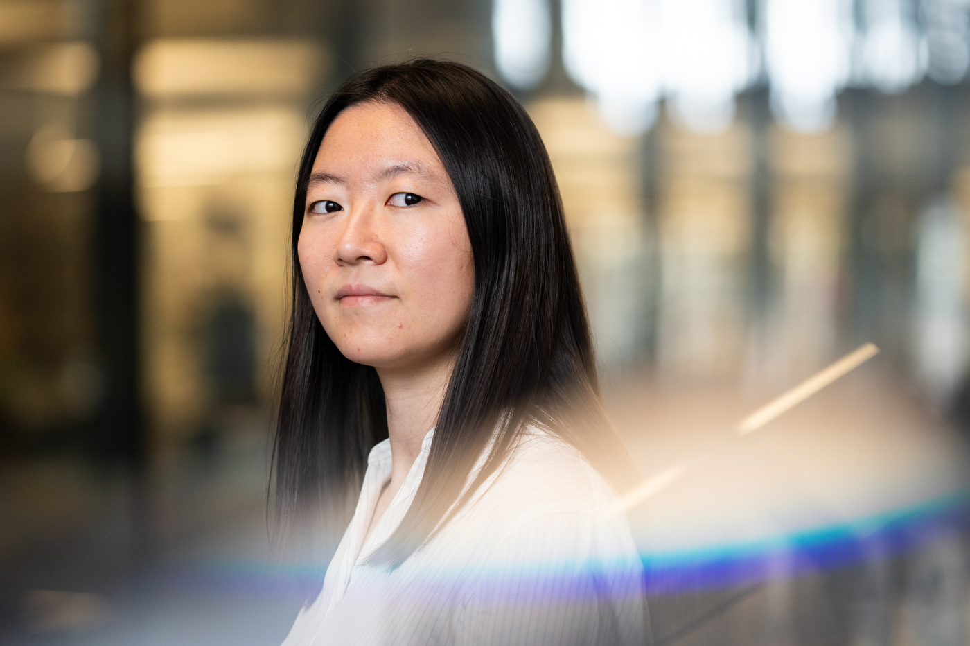 Tianshi Li, a Northeastern professor, looks over her left shoulder with a neutral expression.