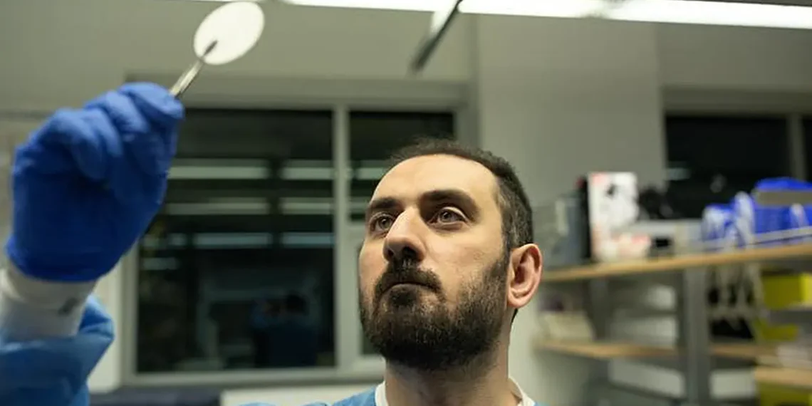 UBC Okanagan doctoral student Mahmoud Babalar examines a sample of the dual-layer modified matrix membrane that can help