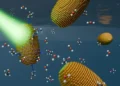 Gold nanorods surrounded by water and ethanol molecules. Illuminating the nanorods generates a photovoltage. This allows