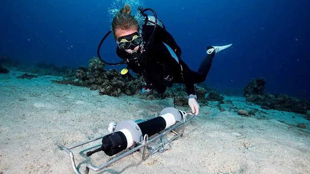 Dr. Herdís Steinsdóttir deploying an instrument near the reef in Eilat to record water currents, allowing her to keep tr