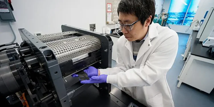 UChicago Pritzker School of Molecular Engineering (UChicago PME) Research Associate Professor Minghao Zhang collects a d