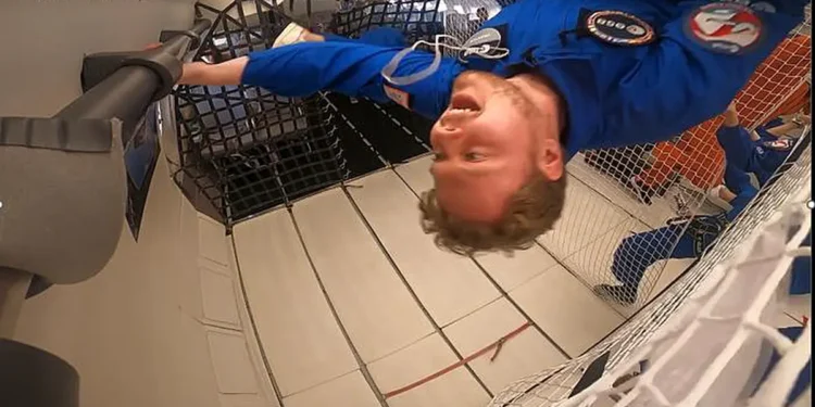 PhD student, Tom Wareing, floating in zero gravity during a parabolic flight.