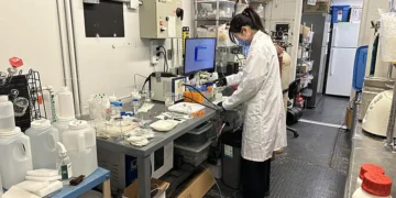 University of Waterloo PhD student Wei Wei, who led the research, in the lab working on plastic upcycling.