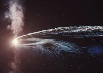 An artistic representation of a tidal disruption event, or a black hole shredding a star.