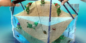 Le monde des électrons, où les électrons (nains) explorent leur bande d'énergie (plage), peut être manipulé à l'aide de champs externes ou de lumière dans des isolants fortement corrélés. Cette capacité permet de créer de nouveaux dispositifs électroniques dotés de fonctionnalités avancées. (Crédit : MANA, NIMS et Science Graphics. Co., Ltd.)