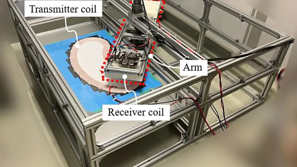 Conception de table pour tester les systèmes DWPT. Ce dispositif rotatif abrite une bobine réceptrice sur son bras à contrepoids, tandis qu'une bobine émettrice est installée le long de son trajet. Il s'adapte à une table et peut simuler des vitesses de véhicule électrique allant jusqu'à 40 km/h