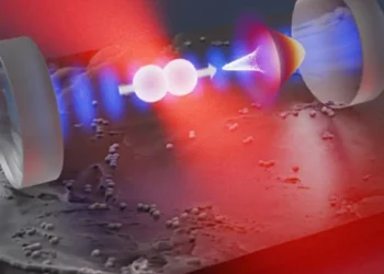 Un nanorotor en silice est piégé par une pince optique (en rouge) à l'intérieur d'un résonateur optique (en bleu). Une fois refroidi, l'alignement du rotor dans le champ de piégeage s'approche de sa limite d'incertitude quantique (cône blanc).