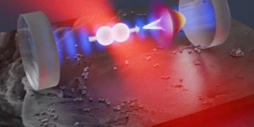 Un nanorotor en silice est piégé par une pince optique (en rouge) à l'intérieur d'un résonateur optique (en bleu). Une fois refroidi, l'alignement du rotor dans le champ de piégeage s'approche de sa limite d'incertitude quantique (cône blanc).