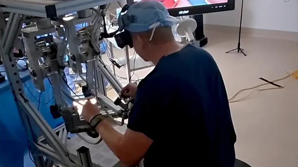 Dr. Ryan Broderick teleoperates a robot during a gallblader removal procedure on a large, non-primate mammal.&nbsp;