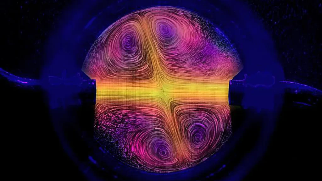 This photo captures the flows coming into the reverse sprinkler, as visualized using particles and false colored.