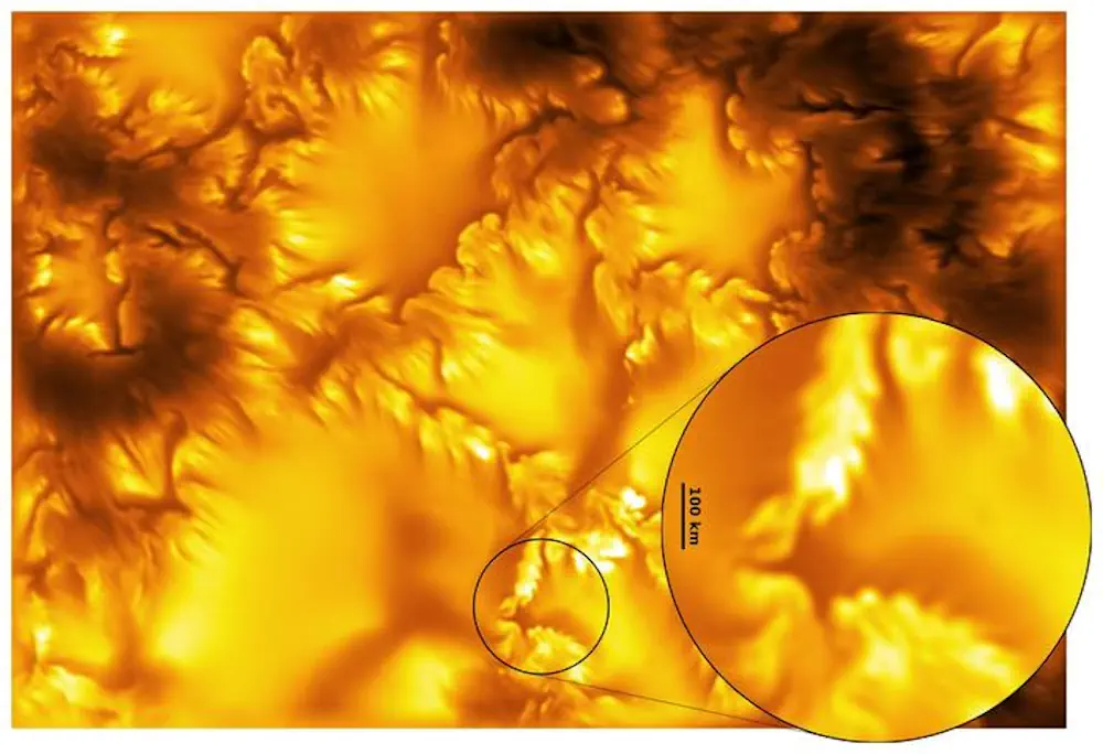 Gros plan tiré d'une image du télescope solaire Inouye mettant en évidence une région de la photosphère solaire. L'encart agrandi révèle les structures magnétiques à petite échelle et les stries sombres associées à l'instabilité de Kelvin-Helmholtz, à une échelle de plusieurs dizaines de kilomètres.