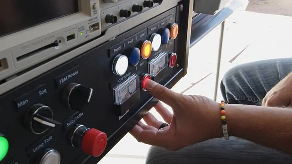 Firing set operator Paul Vinyard prepares to push the button that will initiate the rocket motors to propel the Mobile G
