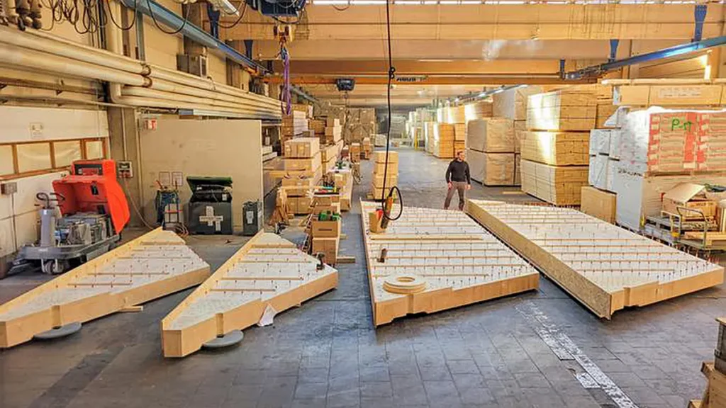 Les segments préfabriqués en bois lamellé-collé rendent ce nouveau système de dalle de plancher particulièrement économique.